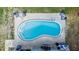 Aerial view of the pool with its patio, landscaping and cozy seating, perfect for warm weather relaxation and entertaining at 15100 Avalon Ave, Clearwater, FL 33760
