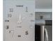 Stylish wall clock with silver hands and numbers adds modern flair to any room at 15100 Avalon Ave, Clearwater, FL 33760