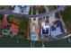 Aerial view of home featuring private dock and pool at 15805 Redington Dr, Redington Beach, FL 33708