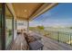 Spacious covered balcony with outdoor seating offering stunning waterfront views and a relaxing atmosphere at 15805 Redington Dr, Redington Beach, FL 33708