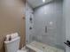 Modern bathroom features a sleek glass enclosed shower with designer tile and a built in storage niche at 15805 Redington Dr, Redington Beach, FL 33708