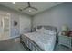 Well-lit bedroom features soft colors, a metal frame bed and access to the second floor at 15805 Redington Dr, Redington Beach, FL 33708
