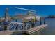 Modern boat on lift with metal frame, near the waterfront at 15805 Redington Dr, Redington Beach, FL 33708