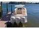 Beautiful motorboat with triple 300 horsepower engines docked at a private pier at 15805 Redington Dr, Redington Beach, FL 33708