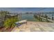 A private dock with boat lift offers direct access to the open water at 15805 Redington Dr, Redington Beach, FL 33708