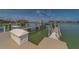 A private dock with boat lift offers direct access to the open water at 15805 Redington Dr, Redington Beach, FL 33708