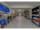 Spacious garage with storage and epoxy floors provides ample room for vehicles and organization at 15805 Redington Dr, Redington Beach, FL 33708