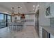 Well-equipped kitchen with stainless steel appliances, white cabinets, and a spacious island at 15805 Redington Dr, Redington Beach, FL 33708