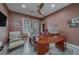 Comfortable home office with built in shelving, comfortable seating and lots of natural light at 15805 Redington Dr, Redington Beach, FL 33708