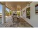 Outdoor dining area with a grill and speakers for backyard entertainment at 15805 Redington Dr, Redington Beach, FL 33708