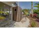 Modern outdoor shower offers a private oasis surrounded by tropical landscaping and is steps from the pool at 15805 Redington Dr, Redington Beach, FL 33708