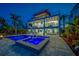 Beautiful three-story home with a pool and spa, perfect for outdoor entertaining at 15805 Redington Dr, Redington Beach, FL 33708