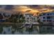 Beautiful three-story home with multiple balconies and waterfront access with a boat lift at 15805 Redington Dr, Redington Beach, FL 33708