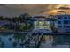 Beautiful waterfront property featuring a pool and private boat dock at 15805 Redington Dr, Redington Beach, FL 33708