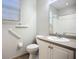 Bathroom featuring grab bars, and a single vanity next to the toilet at 16142 Amethyst Key Dr, Wimauma, FL 33598