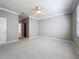 Large carpeted bedroom with natural light and neutral color palette at 16142 Amethyst Key Dr, Wimauma, FL 33598