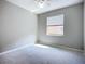Bedroom with carpeted flooring and a window that lets in natural light at 16142 Amethyst Key Dr, Wimauma, FL 33598