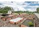 Extensive community garden with raised beds, adjacent shed, and pergola, perfect for the avid gardener at 16142 Amethyst Key Dr, Wimauma, FL 33598
