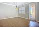 Dining room with tile flooring, crown molding, natural light, and chandelier at 16142 Amethyst Key Dr, Wimauma, FL 33598