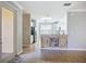 Open kitchen with tile floors, stainless steel appliances, and white cabinetry at 16142 Amethyst Key Dr, Wimauma, FL 33598