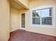 Outdoor patio with brick flooring and window with natural lighting at 16142 Amethyst Key Dr, Wimauma, FL 33598