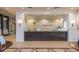Well-lit reception area featuring tiled floors, elegant finishes, and a spacious welcome desk at 16142 Amethyst Key Dr, Wimauma, FL 33598