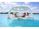 AquaBanas floating cabana in lagoon offers a unique party experience at 17012 Oval Rum Dr, Wimauma, FL 33598