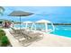 A lounge area with AquaBanas in the community pool at 17012 Oval Rum Dr, Wimauma, FL 33598