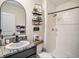 Stylish bathroom featuring a modern sink, shower and decorative shelves at 17012 Oval Rum Dr, Wimauma, FL 33598