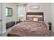 Warm, inviting bedroom with a cozy bed and soft lighting at 17012 Oval Rum Dr, Wimauma, FL 33598
