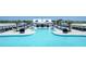 Community swimming pool with a pavilion, cabanas, lounge chairs and meticulously kept landscaping at 17012 Oval Rum Dr, Wimauma, FL 33598