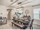 Elegant dining room with stylish lighting and ample seating for gatherings at 17012 Oval Rum Dr, Wimauma, FL 33598