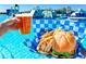 View of burger, fries, and beer at community aqua park at 17012 Oval Rum Dr, Wimauma, FL 33598