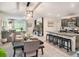 Open-concept kitchen featuring modern appliances, granite countertops, and a breakfast bar at 17012 Oval Rum Dr, Wimauma, FL 33598