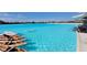 A beautiful lagoon featuring clear blue water and a row of kayaks lined up along the shore at 17012 Oval Rum Dr, Wimauma, FL 33598