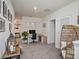 Bright office space featuring a modern desk setup and a cozy wicker chair at 17012 Oval Rum Dr, Wimauma, FL 33598