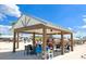 A shaded pavilion with tables and chairs on the beach at 17012 Oval Rum Dr, Wimauma, FL 33598