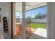 View of backyard with outdoor seating area, patio, and well-maintained lawn at 1813 Hillside Dr, Tampa, FL 33610