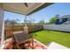 Covered outdoor space includes a wooden table with a view of the lawn at 1813 Hillside Dr, Tampa, FL 33610