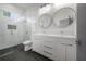 Modern bathroom with double vanity, walk-in shower, and stylish fixtures at 1813 Hillside Dr, Tampa, FL 33610