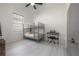 Well-lit room showcasing a bunk bed, keyboard, and a window with horizontal blinds at 1813 Hillside Dr, Tampa, FL 33610