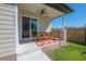 The covered patio with stylish decor, provides an ideal spot for relaxation and entertaining at 1813 Hillside Dr, Tampa, FL 33610