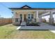 Charming home featuring a covered porch, manicured lawn, and welcoming curb appeal at 1813 Hillside Dr, Tampa, FL 33610