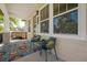 Comfortable porch with a cozy sitting area, offering a relaxing outdoor space at 1813 Hillside Dr, Tampa, FL 33610