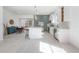 Bright kitchen with white cabinets, stainless appliances, and an island with bar seating at 1813 Hillside Dr, Tampa, FL 33610
