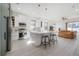 Modern kitchen featuring white cabinets, a large island, and stainless steel appliances, offering plenty of counter space at 1813 Hillside Dr, Tampa, FL 33610