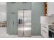 Contemporary kitchen featuring stainless steel refrigerator, and built-in shelving for a sleek and organized look at 1813 Hillside Dr, Tampa, FL 33610