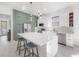 Modern kitchen with stainless steel appliances, center island, and ample counter space at 1813 Hillside Dr, Tampa, FL 33610