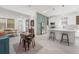 Open concept kitchen and dining area with modern appliances and stylish decor at 1813 Hillside Dr, Tampa, FL 33610