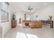 Spacious living room with ample natural light, featuring a leather couch and contemporary decor, offers comfortable living at 1813 Hillside Dr, Tampa, FL 33610
